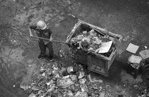 Skip container being delivered to a residential area in Millbank